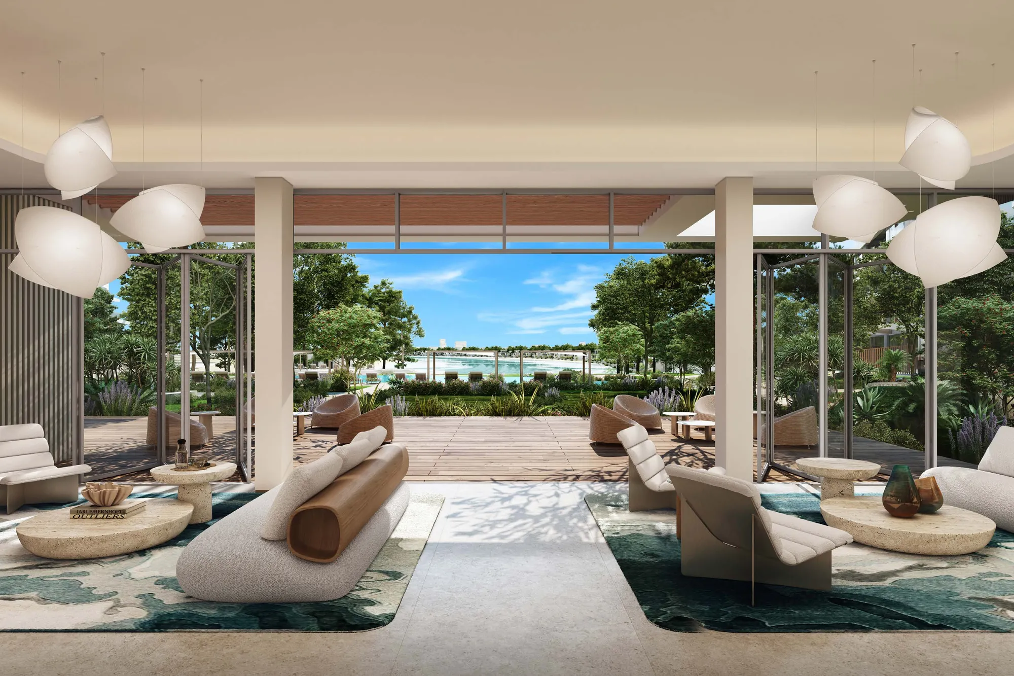 Clubhouse lounge opening onto a timber deck, gardens and the beach