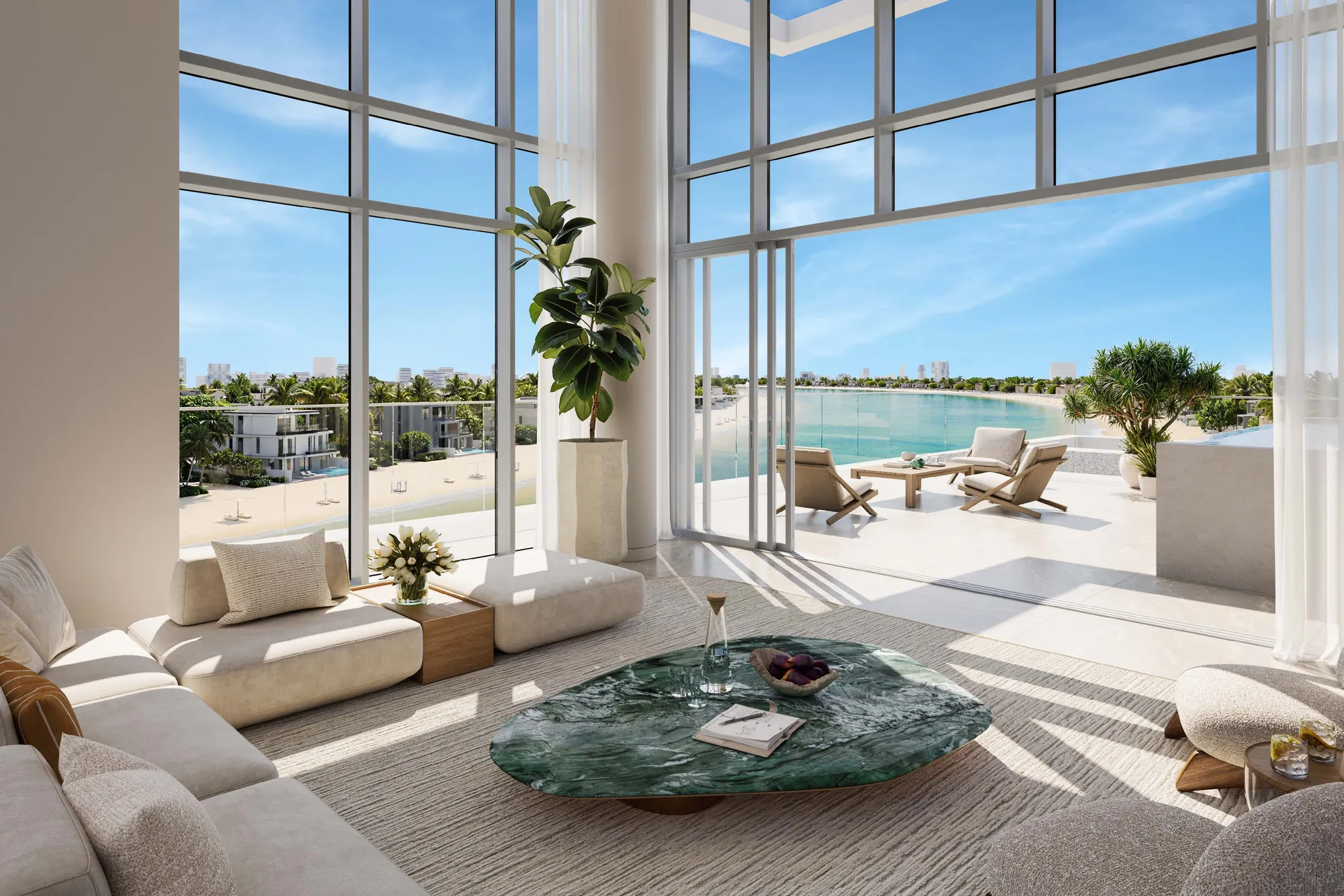 Penthouse living room with tall glazing opening onto a sea-view terrace